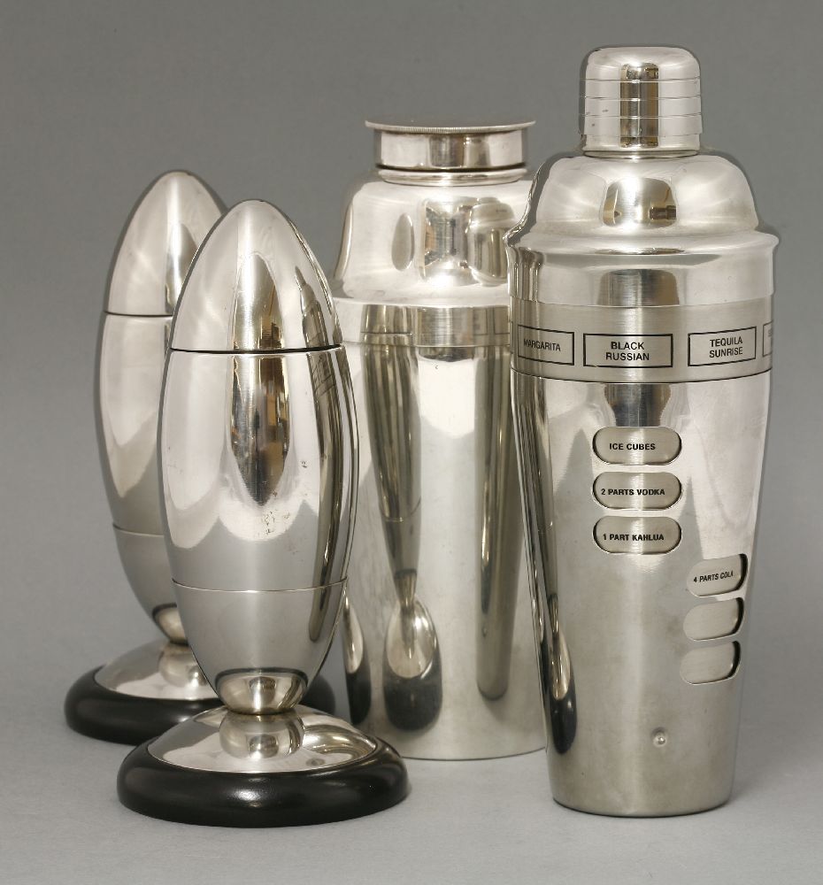 A pair of chrome cigar-shaped cocktail shakers,detachable, on ebonised plinths,20cm high, andtwo - Image 2 of 2