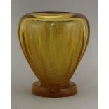 An Art Deco amber glass vase,deeply moulded and 'frosted',17.5cm high