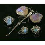 A pair of Arts and Crafts black opal doublet earrings,each one with a circular black opal doublet