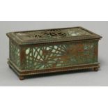 A Tiffany Studios' gilt brass and glass pierced casket,the pierced web panels with a beaded