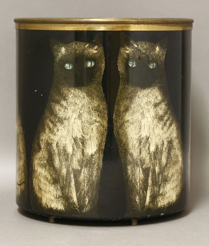 A waste paper bin,by Piero Fornasetti, lithographed with a Siamese cat, with a brass mount and feet,