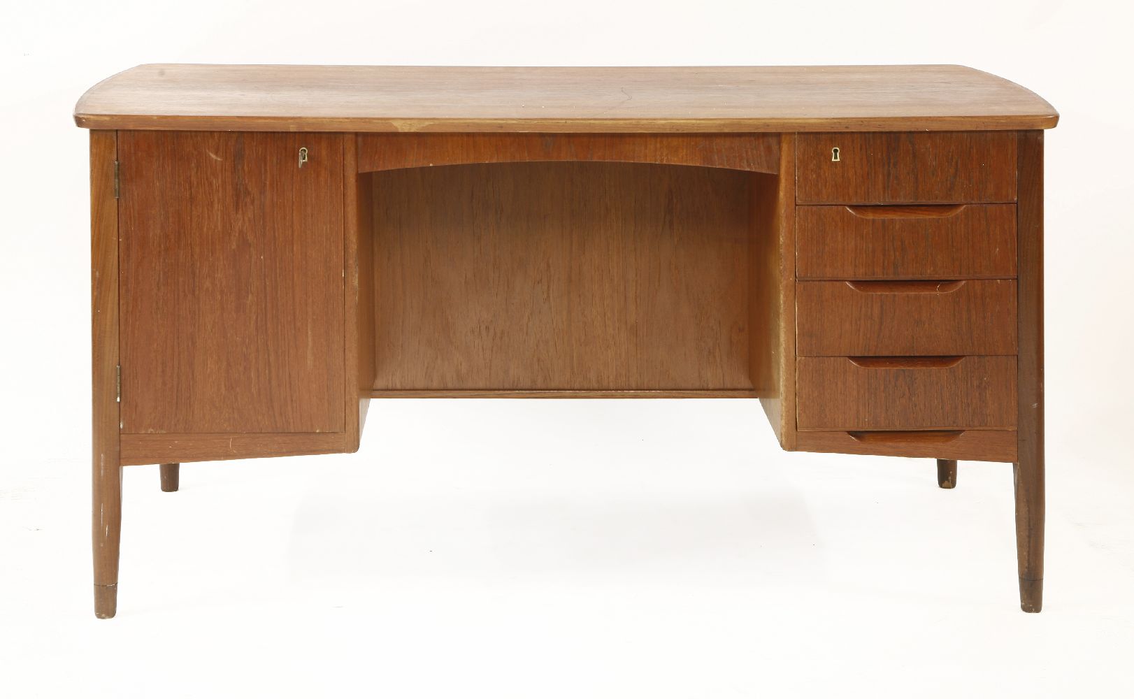 A Danish teak desk,with a cupboard and drawers to the front, and two shelves to the reverse,143.