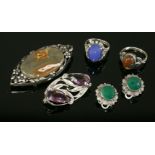 An Arts and Crafts agate brooch,attributed to Bernard Instone, an oval agate plaque, four claw set