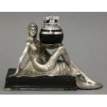 A Ronson 'Rondelight' desk lighter,modelled as an Egyptian lady holding a detachable globe