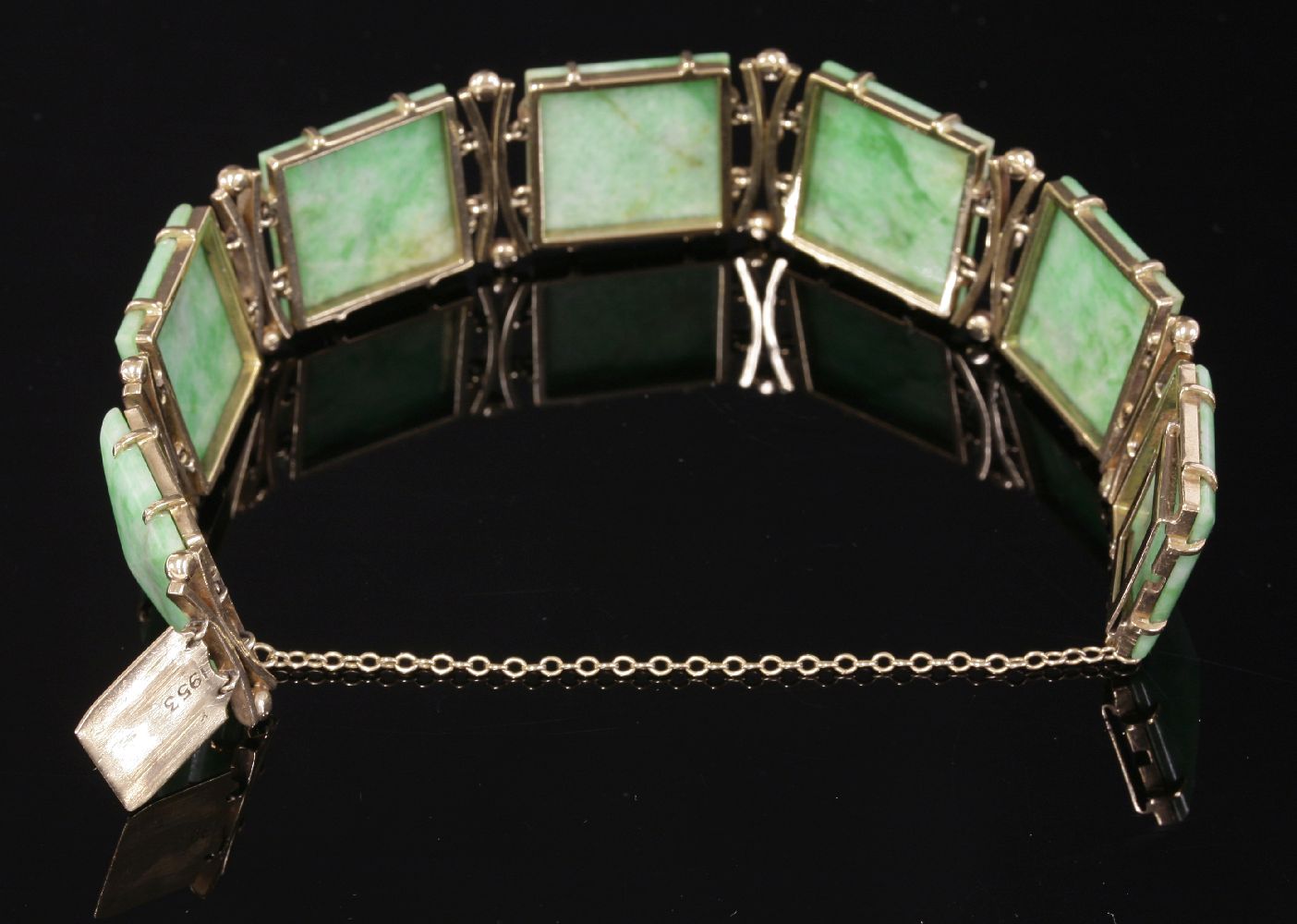 A gold mounted jade plaque link bracelet, c.1950,with a series of shallow square jade pyramid - Image 2 of 2