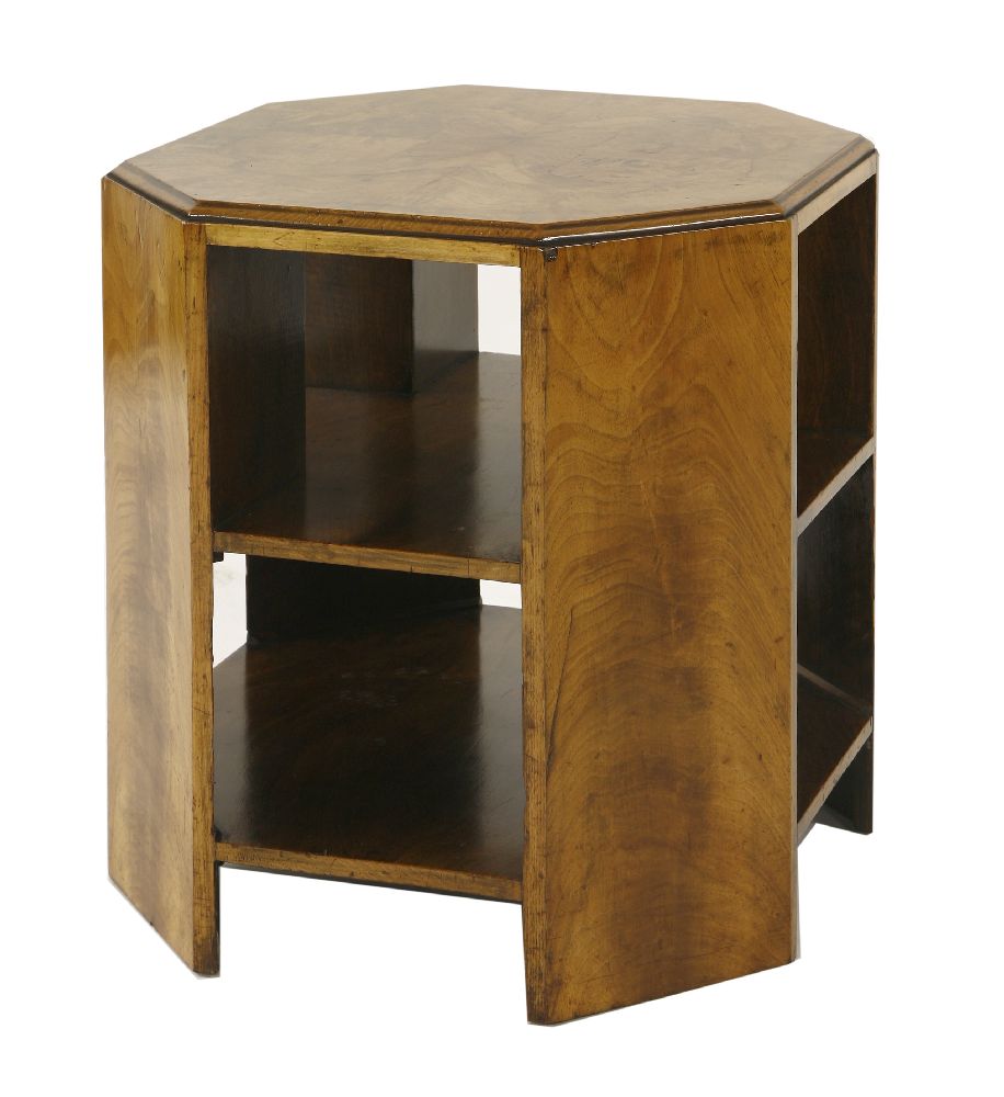 An Art Deco walnut booktable,the octagonal top with a quarter veneered surface, with two tiers of