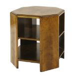 An Art Deco walnut booktable,the octagonal top with a quarter veneered surface, with two tiers of