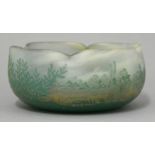 A Daum Nancy etched bowl, quatrelobed form and decorated with a river landscape with bushes and