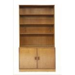 A teak open bookcase,with cupboard below,100cm wide47cm deep181cm high
