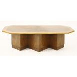 An Art Deco walnut and sycamore coffee table,with canted corners, raised on a plinth stand,127.5cm