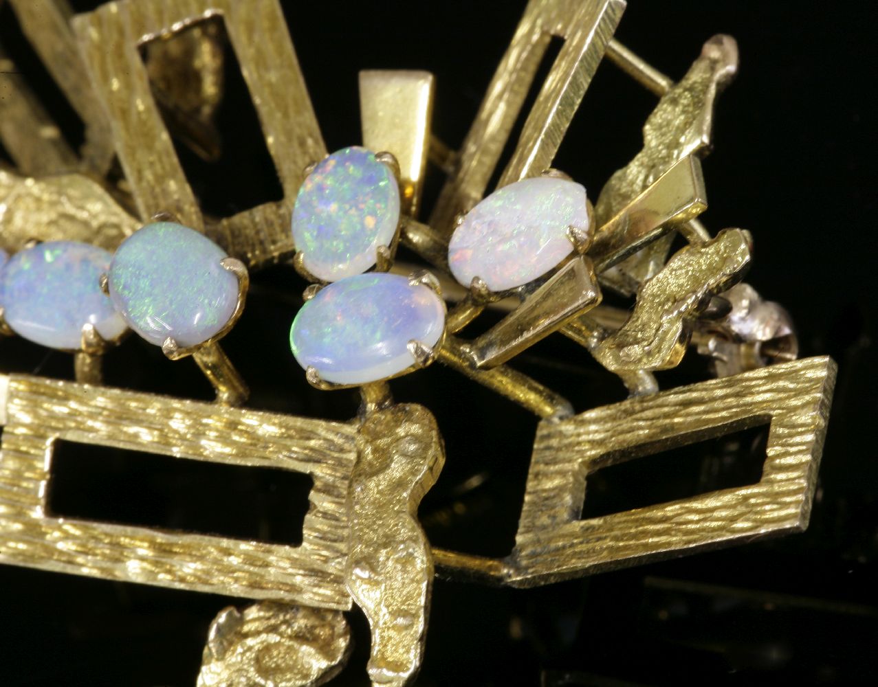 A Continental gold opal brooch, c.1970,with radiating rectangular frames, each frame with bark - Image 3 of 3