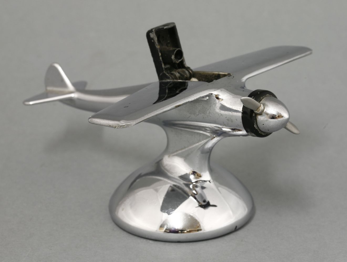 A chrome plane table lighter,with the propeller activating the lighter opening, the cockpit labelled - Image 2 of 3