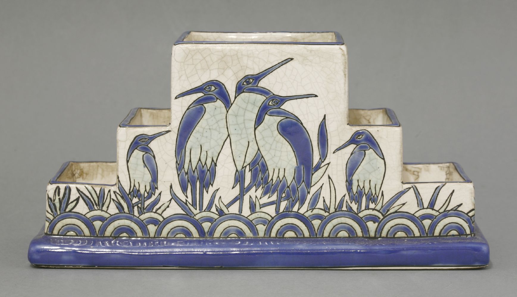A Keralouve style pottery desk stand,with a crackle glazed body, painted and glazed with storks,