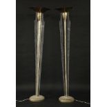 A pair of brass and lucite uplighters,178cm high (2)