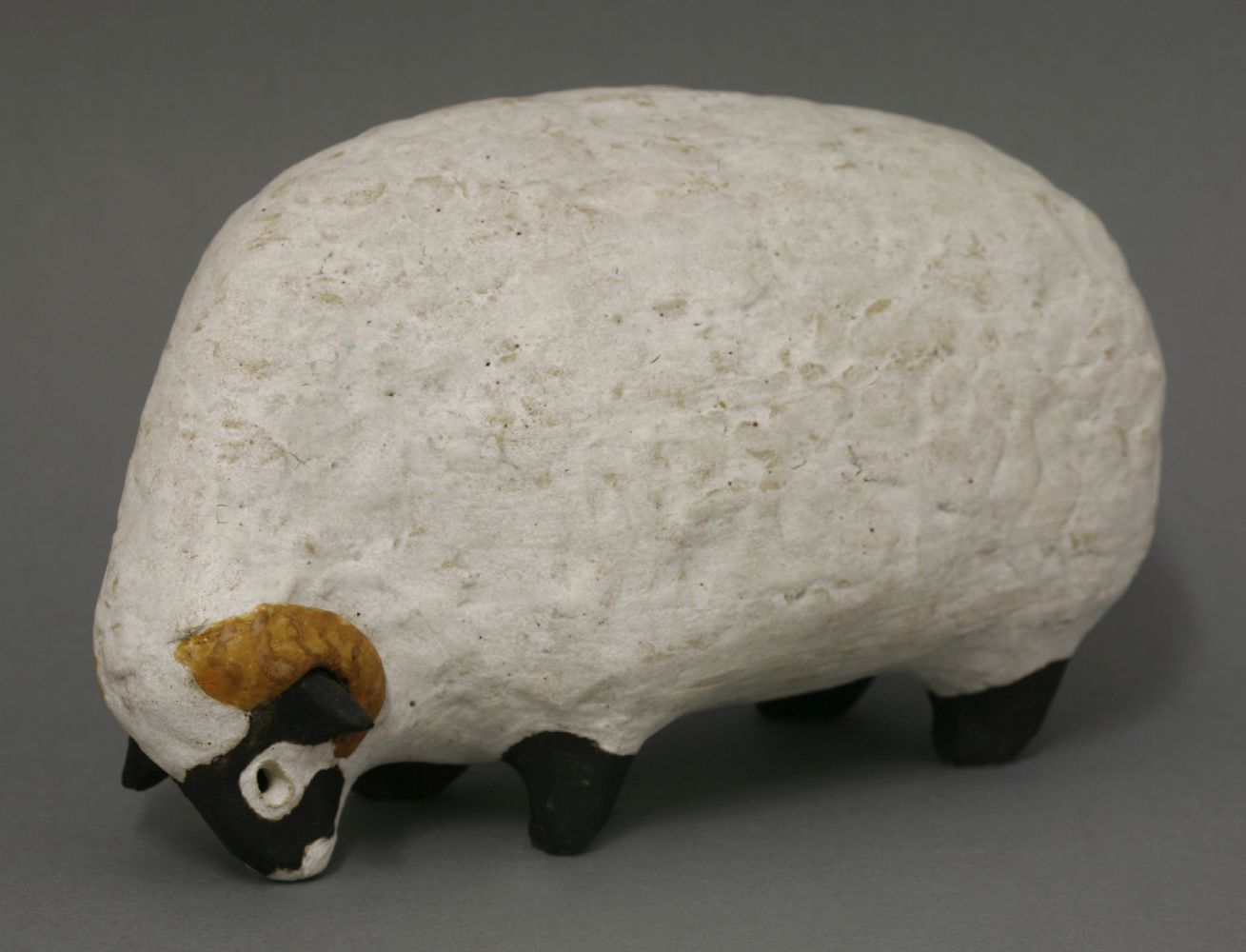 *A stoneware ram,by Rosemary Wren (1922-2013) and Peter Crotty (b.1943), signed with initials,21cm
