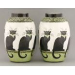 A pair of Keralouve style pottery vases,each with crackle glaze bodies, painted and glazed with a