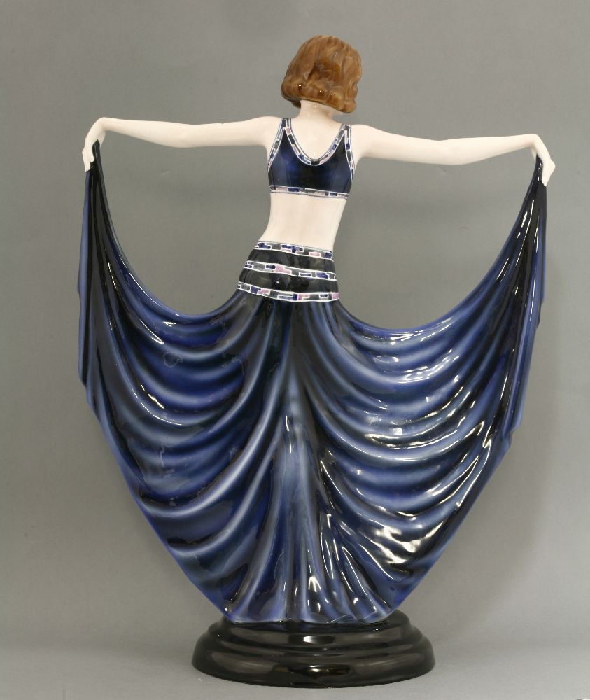 A Goldscheider figure of a dancer,model no. 6173, modelled holding her dress, in blue with - Image 2 of 3