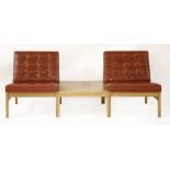 A Danish oak and red leather waiting room suite,comprising two armchairs centred with a table,