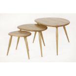 An Ercol nest of three 'Pebble' tables,one labelled, 65cm wide45cm high (3)
