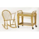 An Ercol child's rocking chair,labelled and with 'Utility Furniture' stamp, anda walnut hostess
