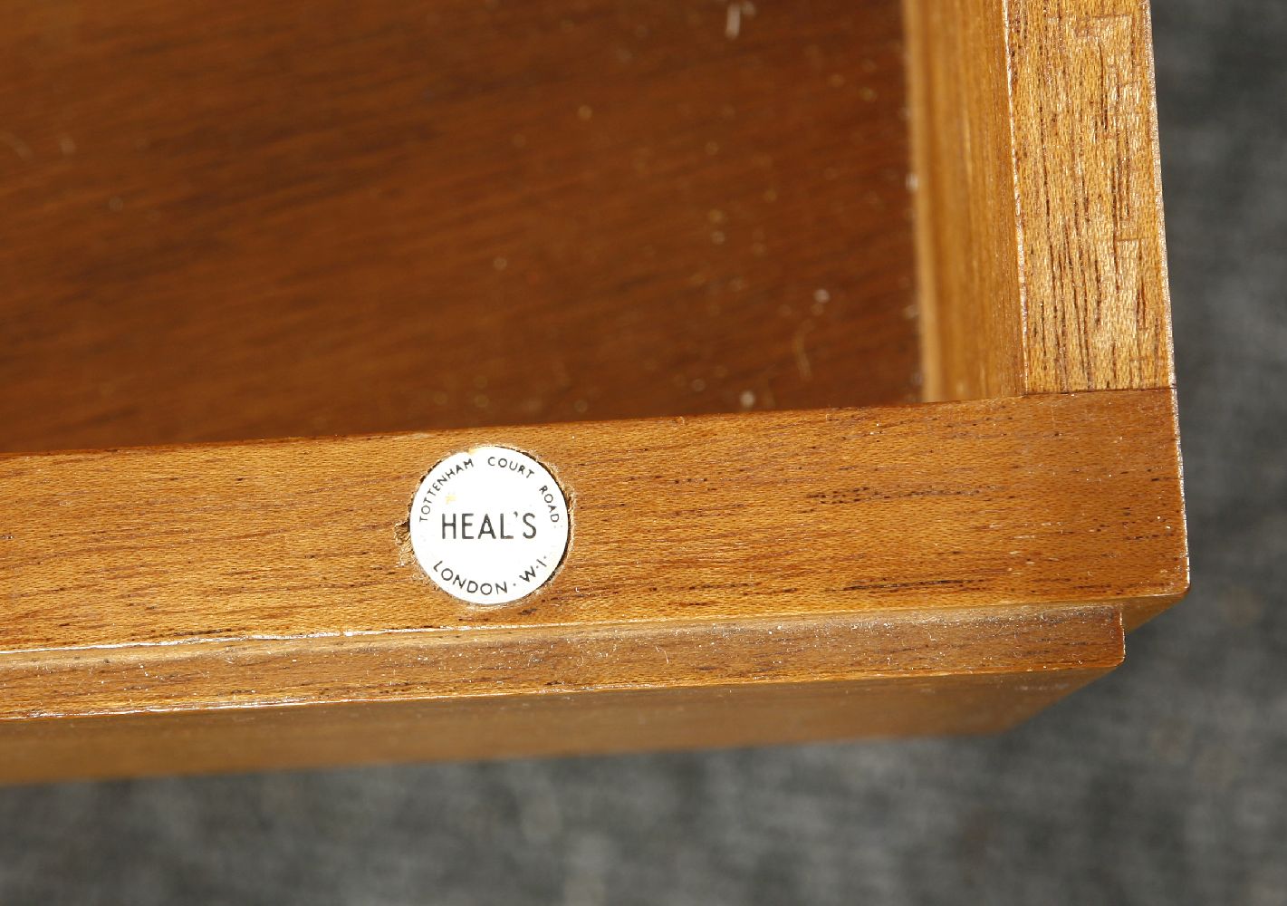 An Heal's teak and oak sideboard,with a hinged drop cabinet and four drawers, with Heal's label to - Image 2 of 2