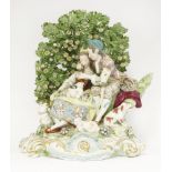 A massive Samson porcelain bocage Group,late 19th century, in the form of a shepherdess, her beau, a