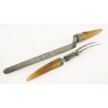 A Victorian two-piece carving set,with ivory handles, applied with Butter family coat of arms, the