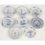 Eight English blue and white delft Plates,mid-18th century,six with flowers and foliage,one with a