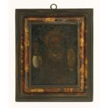 A tortoiseshell picture frame, 18th/19th century, with a 17th century oil painting of a saint (on