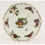 A Chelsea gold anchor Plate,c.1756-1769, decorated with fruit and butterflies within a moulded