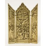 A carved ivory triptych, 19th century, carved in relief with Christ upon the cross surrounded by