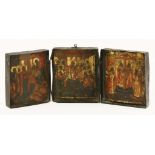 A travelling icon triptych,19th century, in a hinged tin box,each panel 10 x 8cm