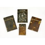 Four tortoiseshell card cases,19th century,one with pressed decoration in the form of a cathedral