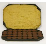 A Victorian cased set of thirty-six terracotta medallions,depicting Kings and Queens of England,
