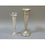 Two silver spill vases, one with a shaped rim, the other octagonal pierced rim, both loaded, 25.