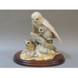 A Teviotdale resin group, 'Snowy Owl and Owlets'