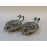 A pair of Egyptian style bronze oil lamps, 18cm long