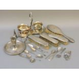Various silver items, including a hairbrush set, teaspoons, a silver plated chamberstick and
