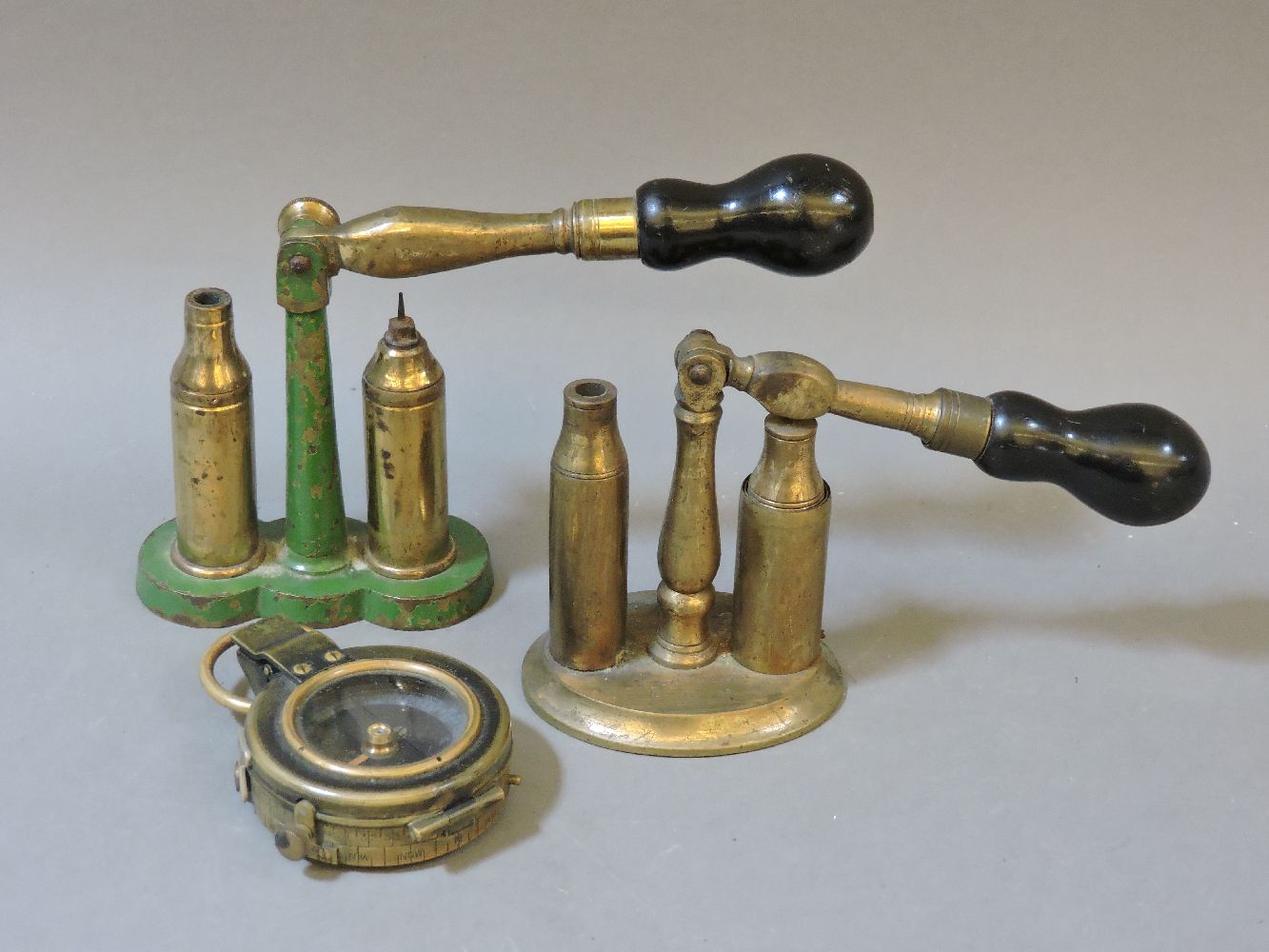 Two cartridge reloaders, and a military compass, F-L No 90609 1917