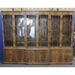 A large mahogany three section glazed bookcase, with astragal glazed doors enclosing top over