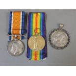 A World War I Victory and War medal, awarded to 163457 Gnr J Wood RA, each with ribbons, and a