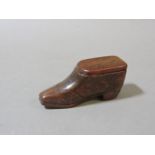 A treen snuff box, in the form of a ladies boot, with initials WM