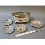 A George III silver condiment stand, a silver mounted ivory paper knife/letter opener, a silver dish