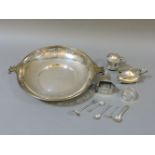 A silver two handled bowl, by Barraclough & Sons, two silver mustard pots, two napkin rings, and