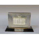 A silver and ebonised wooden desk calendar, by W J Myatt & Co, Birmingham 1937, with presentation