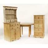 Modern pine furniture, including a table, dresser and a chest
