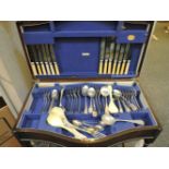 A part canteen of cutlery, a salver, blue and white pearl ware plates and bowls, glass decanters,