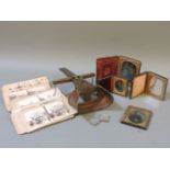 A Victorian mahogany viewer, with slides of an Edwardian wedding, and four ambrotypes, a pair of