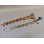 An Indonesian kris sword, with curved blade, in a wooden sheath, 69cm long and a Japanese wooden and