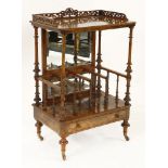 A Victorian strung walnut whatnot, with a fret cut 3/4 gallery over a shelf, on turned supports, a